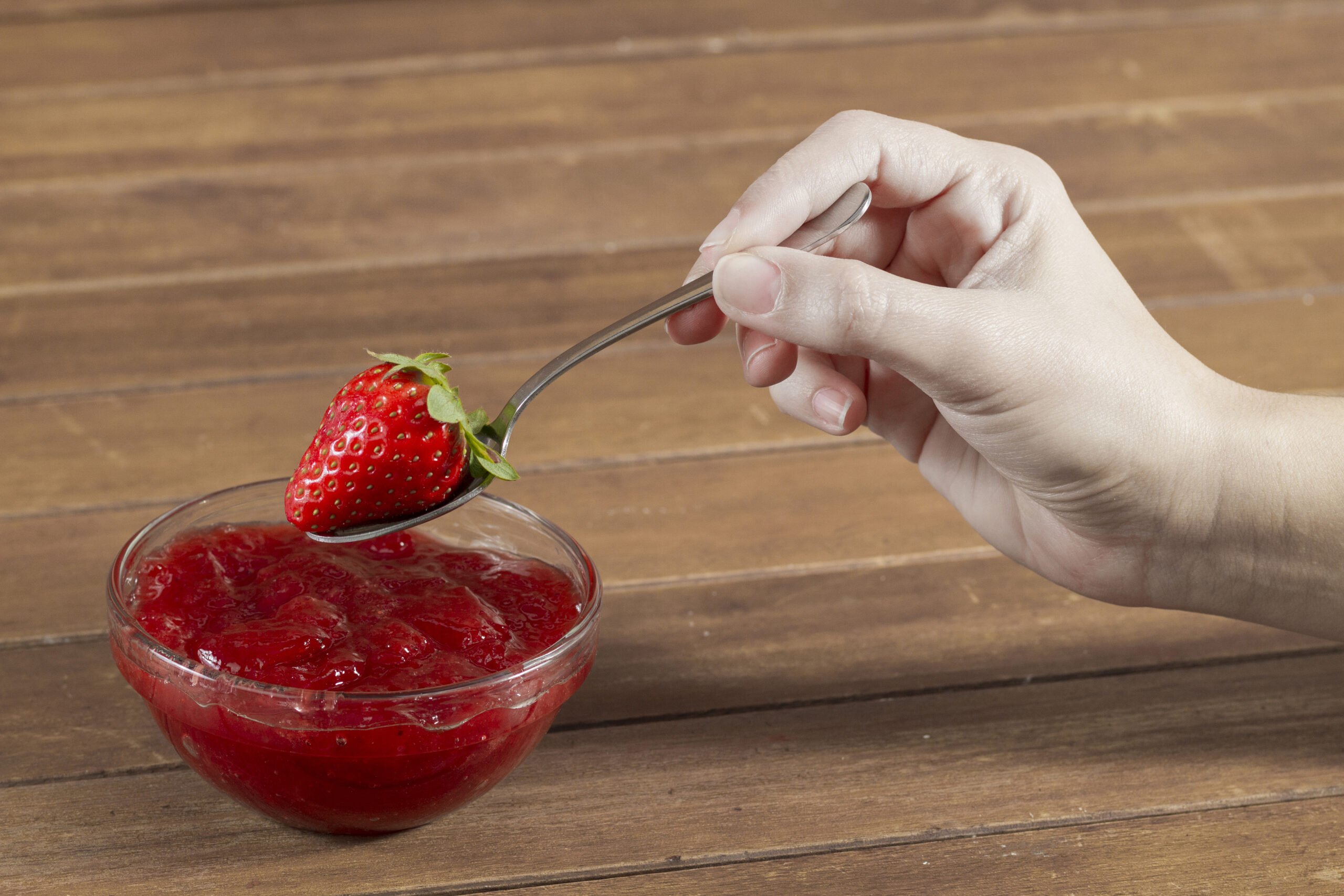 hand-holding-spoon-with-strawberry