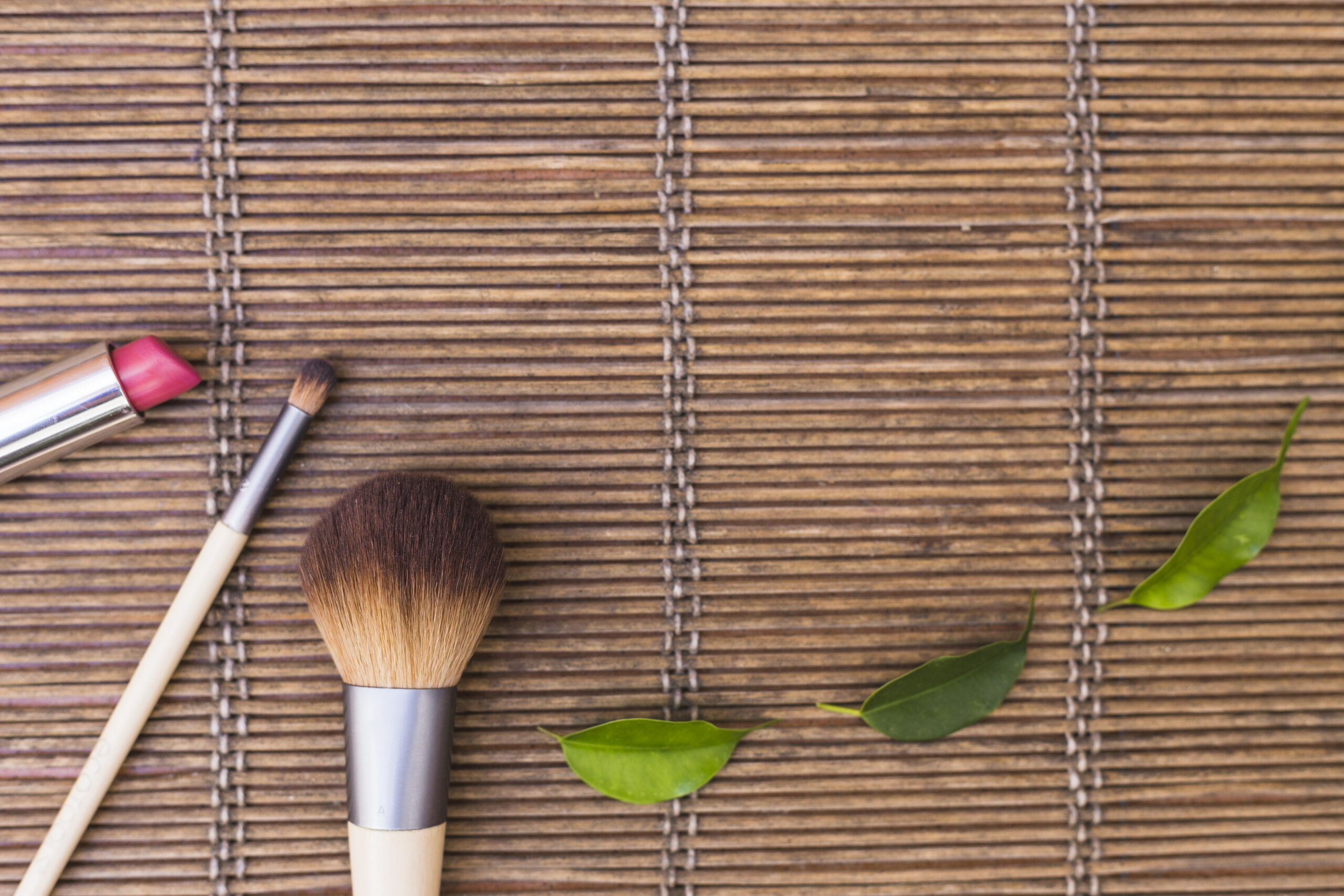 makeup-brushes-with-lipstick-green-leaves-placemat